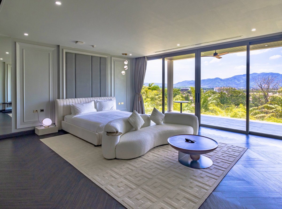 Mountain-view primary bedroom at Villa Lion